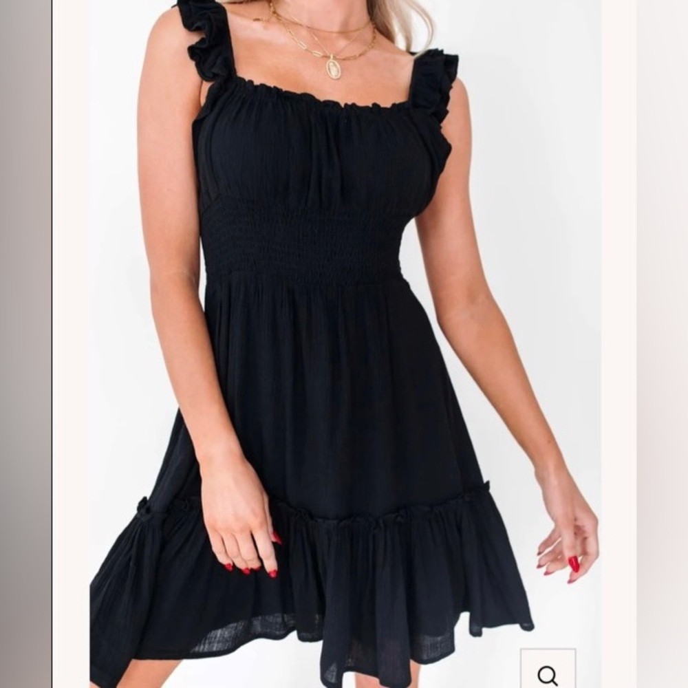 NEVER WORN. Flowy black dress with ruffles.